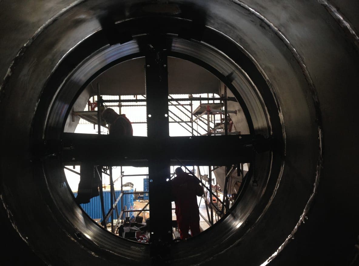 OSM technician performing in-place portable flange facing