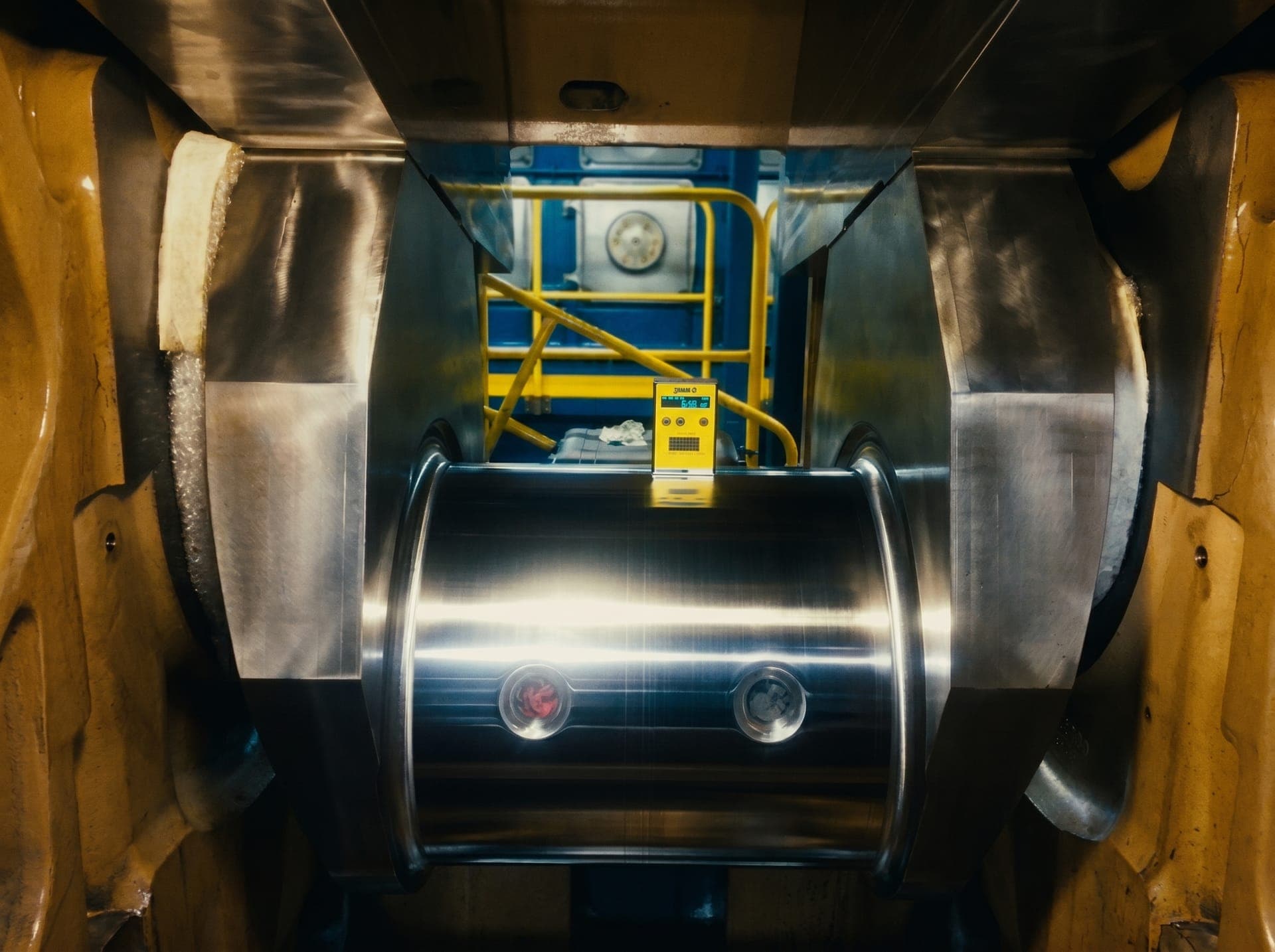 OSM technician performing onsite NDT inspection on a marine shaft